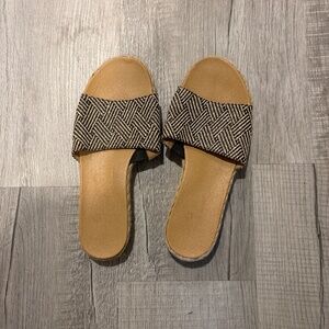 Woman’s black and tan One strap sandal